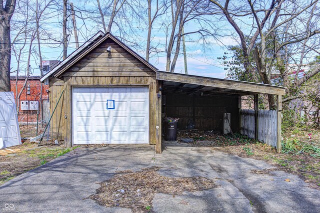 110 E Hendricks St, Shelbyville, IN 46176 - garage with driveway and a garage
