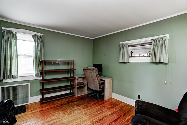 110 E Hendricks St, Shelbyville, IN 46176 - office space with radiator, crown molding, baseboards, and wood finished floors
