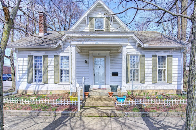 110 E Hendricks St, Shelbyville, IN 46176 - view of front facade with a chimney
