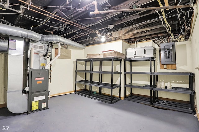 unfinished below grade area with heating unit and electric panel