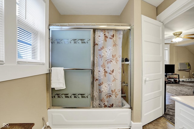 bathroom featuring bath / shower combo with glass door, tile patterned flooring, vanity, and a ceiling fan