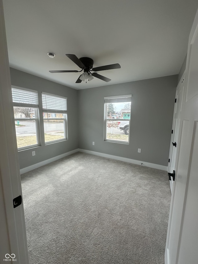 1746 Lambert St, Indianapolis, IN 46221 - carpeted empty room with a wealth of natural light and baseboards