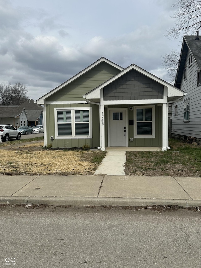 1746 Lambert St, Indianapolis, IN 46221 - bungalow-style home featuring board and batten siding and a porch