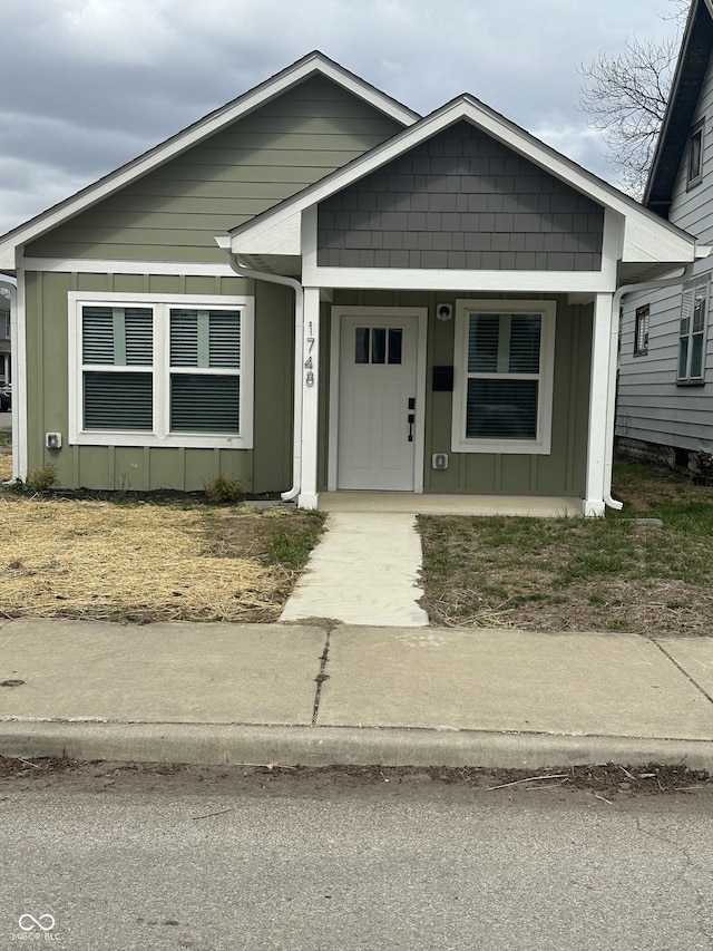 1746 Lambert St, Indianapolis, IN 46221 - view of front of home featuring covered porch and board and batten siding