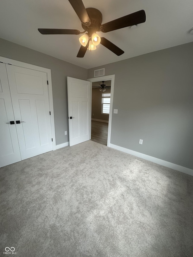 1746 Lambert St, Indianapolis, IN 46221 - unfurnished bedroom featuring carpet flooring, a ceiling fan, baseboards, and visible vents