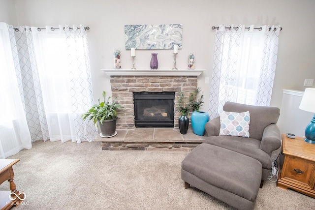 living room with carpet floors and a brick fireplace