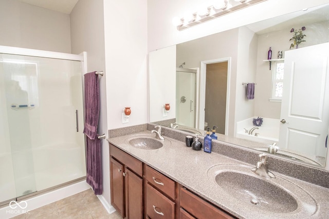 full bathroom with a sink, a stall shower, tile patterned flooring, and toilet
