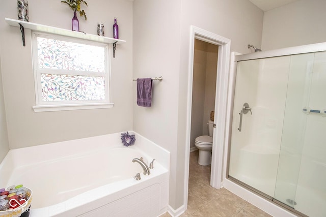 full bathroom with toilet, tile patterned floors, a garden tub, and a shower stall