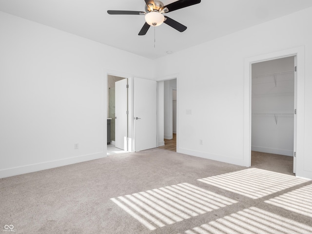 2578 Filson St, Carmel, IN 46032 - unfurnished bedroom featuring baseboards, light carpet, a closet, and a spacious closet