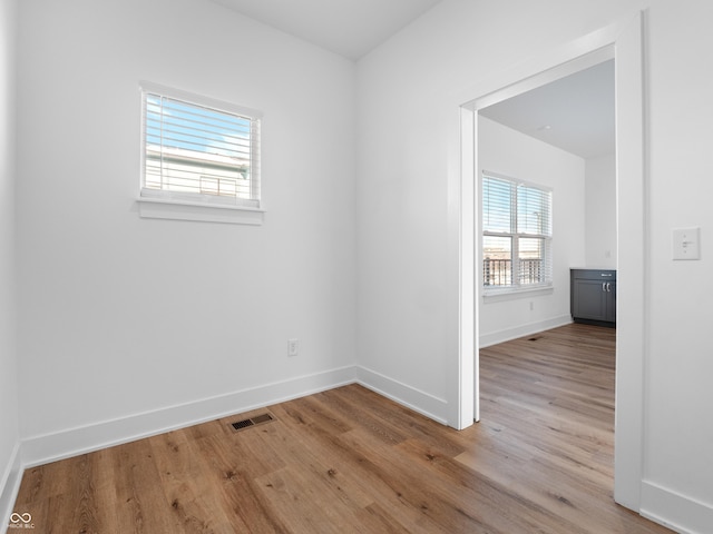 2578 Filson St, Carmel, IN 46032 - unfurnished room with baseboards, visible vents, and wood finished floors