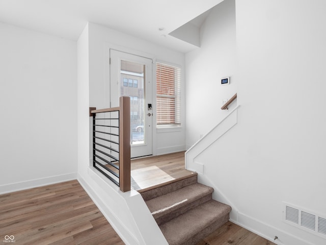 2578 Filson St, Carmel, IN 46032 - stairway with baseboards, wood finished floors, and visible vents