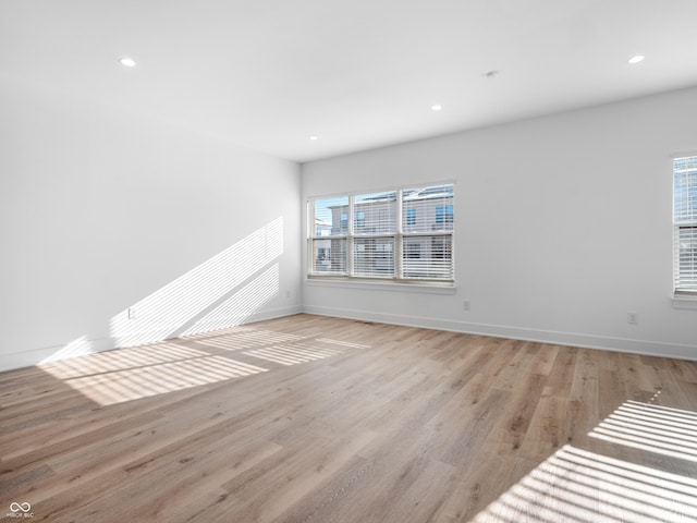 2578 Filson St, Carmel, IN 46032 - unfurnished living room with recessed lighting, baseboards, and light wood finished floors