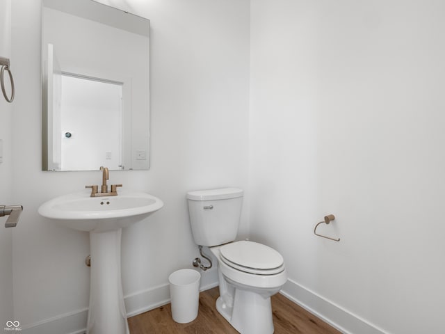 2578 Filson St, Carmel, IN 46032 - bathroom with baseboards, wood finished floors, and toilet