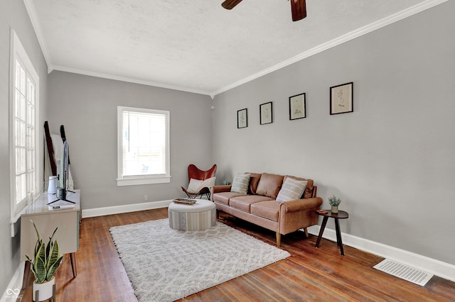 112 S Spencer Ave, Indianapolis, IN 46219 - living area with baseboards, visible vents, wood finished floors, and ceiling fan