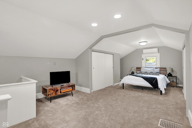 112 S Spencer Ave, Indianapolis, IN 46219 - bedroom featuring vaulted ceiling, a wall mounted AC, baseboards, visible vents, and carpet