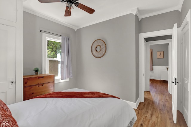 112 S Spencer Ave, Indianapolis, IN 46219 - bedroom with crown molding, baseboards, light wood finished floors, and ceiling fan