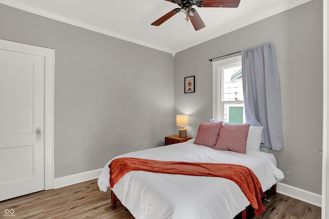 112 S Spencer Ave, Indianapolis, IN 46219 - bedroom with a ceiling fan, ornamental molding, baseboards, and wood finished floors
