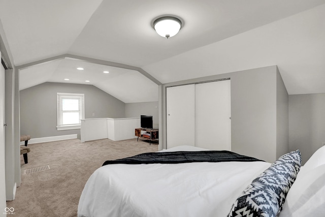 112 S Spencer Ave, Indianapolis, IN 46219 - bedroom featuring a closet, lofted ceiling, visible vents, and carpet