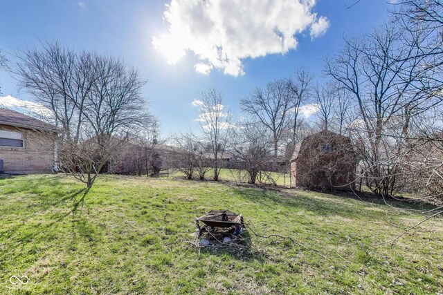7906 E 21st St, Indianapolis, IN 46219 - view of yard with an outdoor fire pit, an outbuilding, and a barn