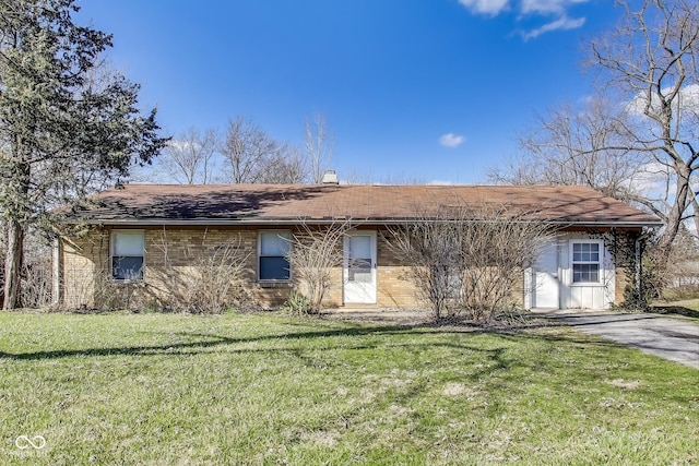 7906 E 21st St, Indianapolis, IN 46219 - ranch-style house featuring a front yard, a shingled roof, and a chimney
