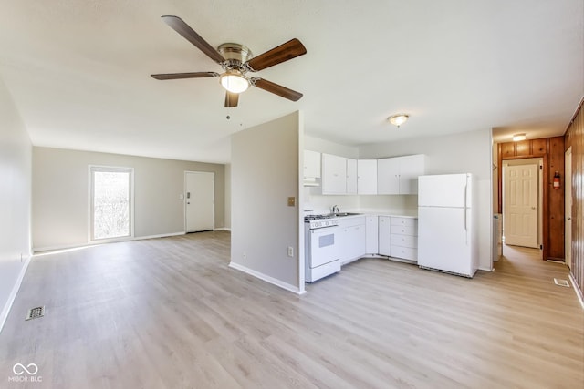 7906 E 21st St, Indianapolis, IN 46219 - kitchen featuring light countertops, exhaust hood, white appliances, visible vents, and white cabinets