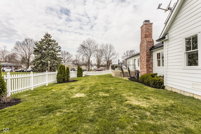 view of yard featuring a fenced backyard and a deck