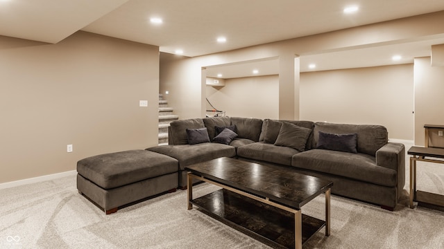 living area featuring light carpet, baseboards, stairway, and recessed lighting