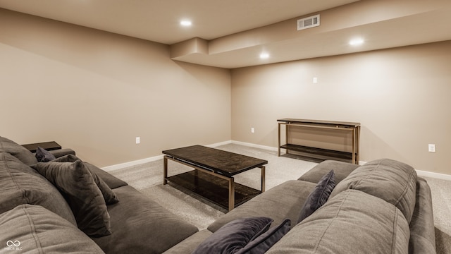 living room featuring recessed lighting, carpet, baseboards, and visible vents