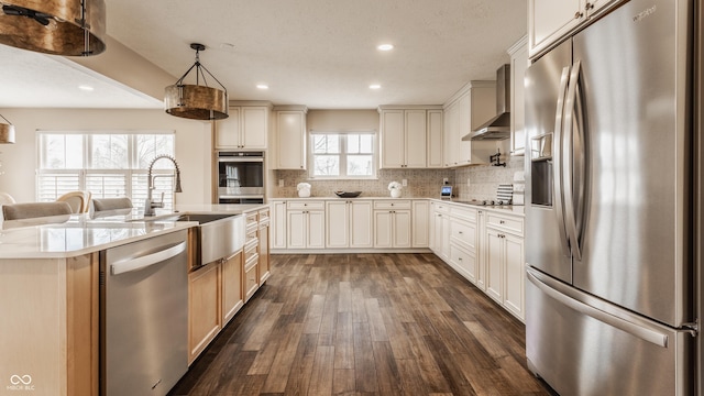 kitchen featuring stainless steel appliances, dark wood-style floors, tasteful backsplash, and wall chimney exhaust hood