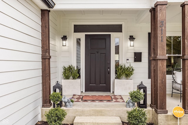 property entrance with covered porch