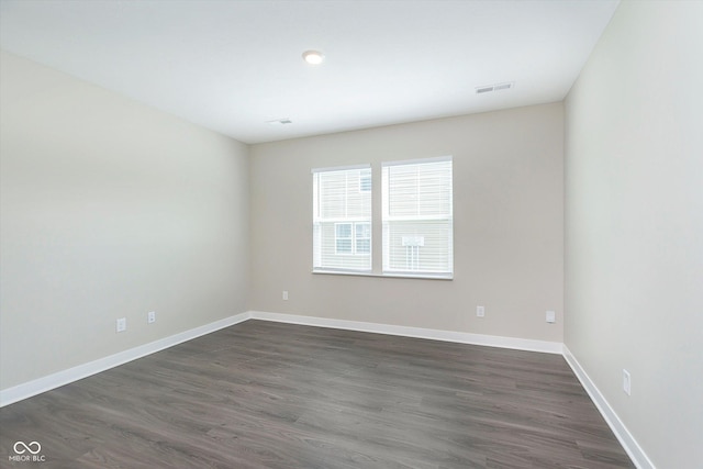 1239 Newton St, Avon, IN 46123 - empty room with visible vents, baseboards, and dark wood-type flooring