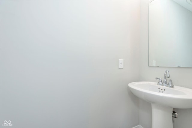 1239 Newton St, Avon, IN 46123 - bathroom featuring baseboards and a sink