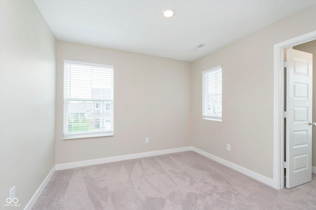 1239 Newton St, Avon, IN 46123 - spare room featuring light colored carpet, visible vents, and baseboards