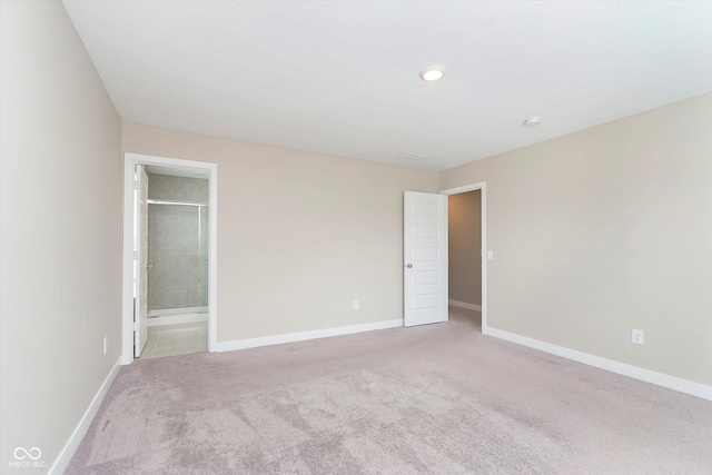 1239 Newton St, Avon, IN 46123 - unfurnished bedroom with light colored carpet, connected bathroom, and baseboards