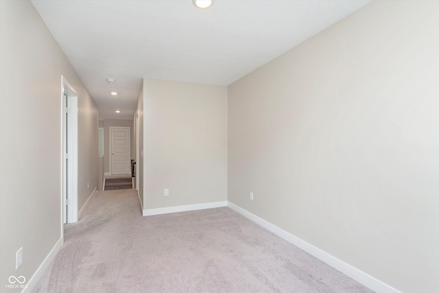 1239 Newton St, Avon, IN 46123 - spare room featuring light carpet, baseboards, and recessed lighting