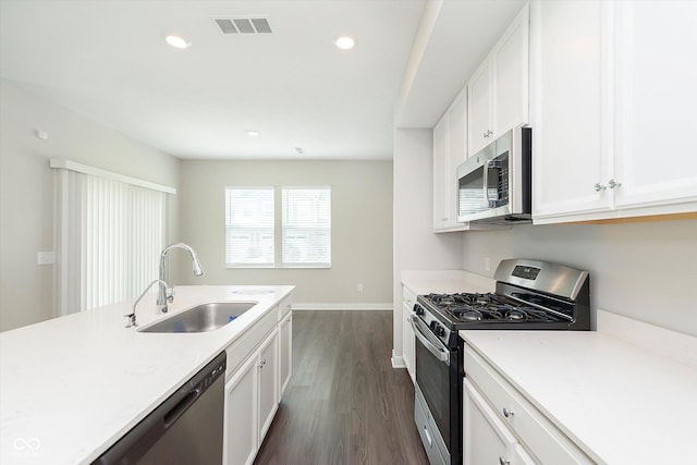 1239 Newton St, Avon, IN 46123 - kitchen featuring baseboards, visible vents, a sink, appliances with stainless steel finishes, and dark wood-style floors
