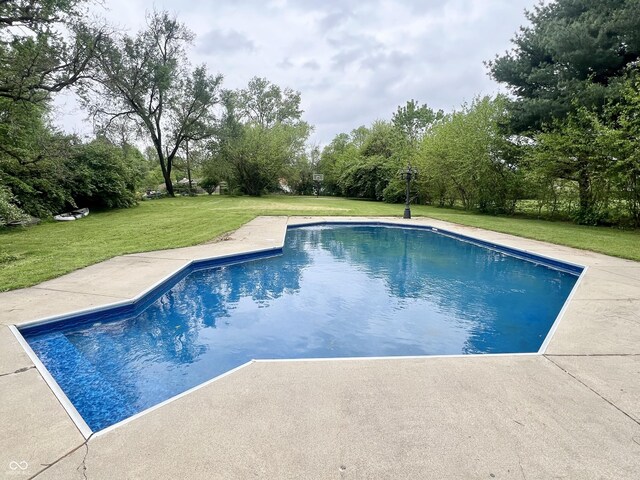 1707 Rocky Ford Rd, Columbus, IN 47203 - outdoor pool featuring a yard and a patio area