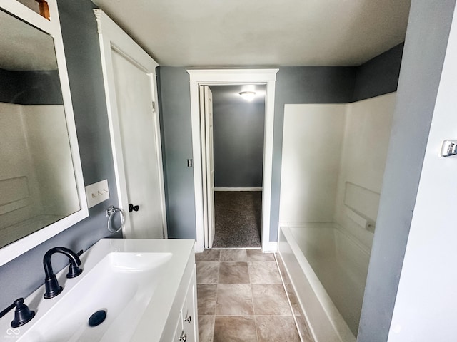 bathroom with vanity, walk in shower, and a bathtub