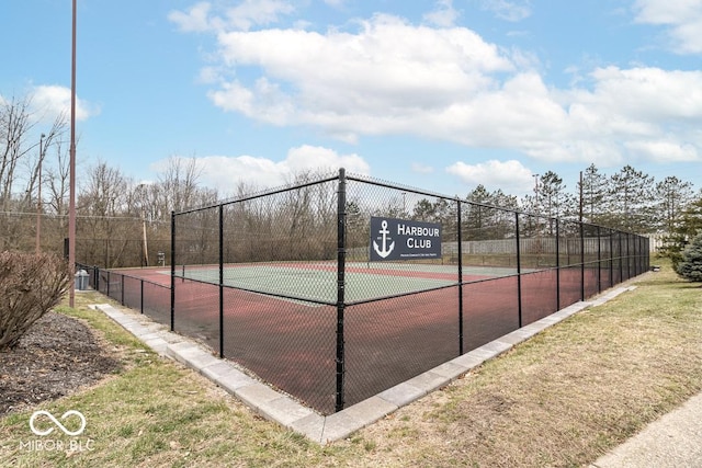 view of tennis court with fence