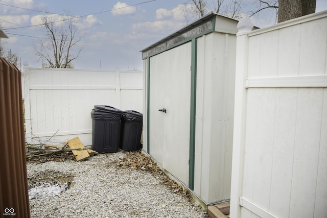 view of outbuilding featuring an outbuilding and fence