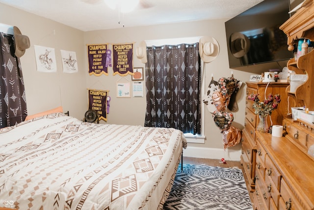 bedroom featuring baseboards