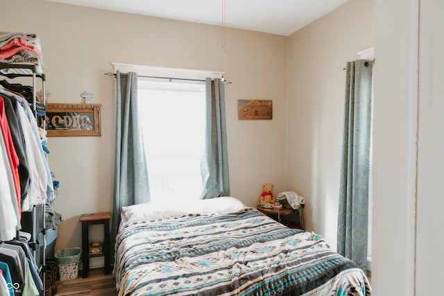 bedroom featuring wood finished floors