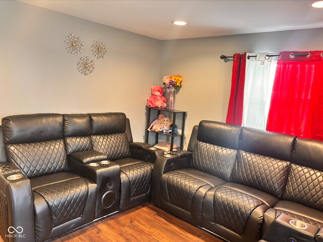 living area with wood finished floors and recessed lighting