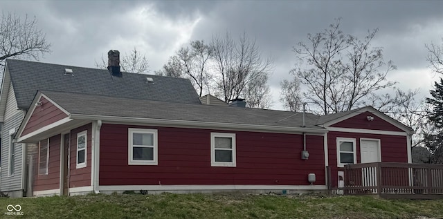 rear view of property with a chimney