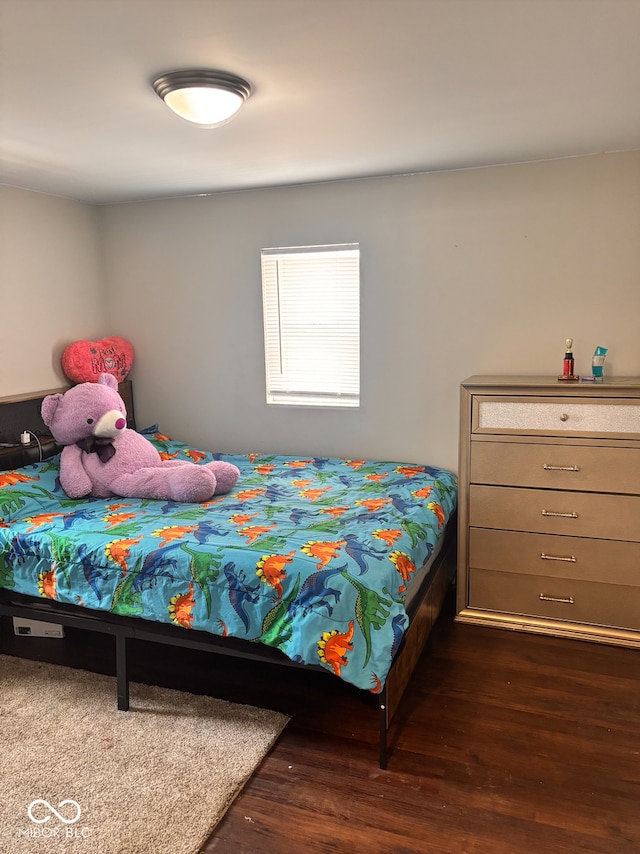 bedroom featuring dark wood-type flooring