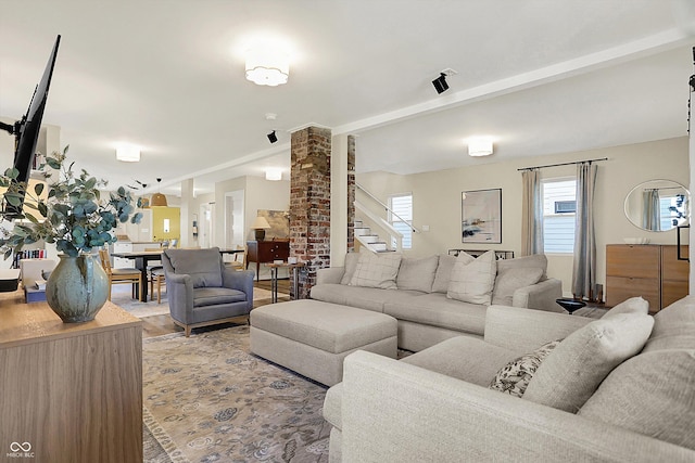 934 E Minnesota St, Indianapolis, IN 46203 - living area with vaulted ceiling with beams, decorative columns, and stairs