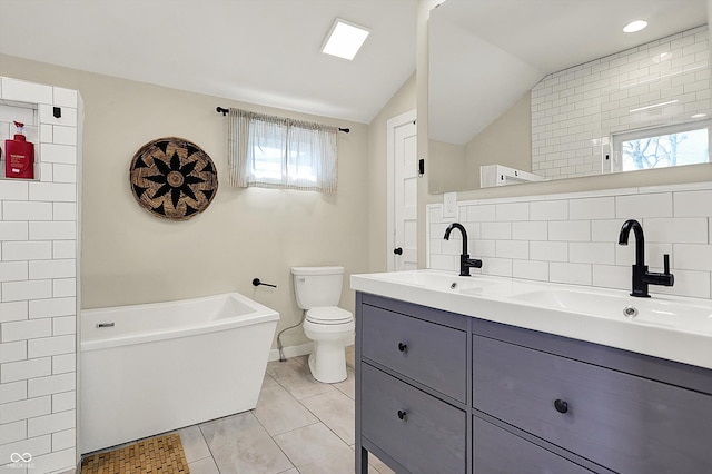 934 E Minnesota St, Indianapolis, IN 46203 - full bath featuring a soaking tub, double vanity, a sink, and tile patterned floors