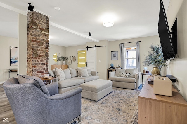 934 E Minnesota St, Indianapolis, IN 46203 - living area featuring a barn door, light wood-style flooring, and beam ceiling