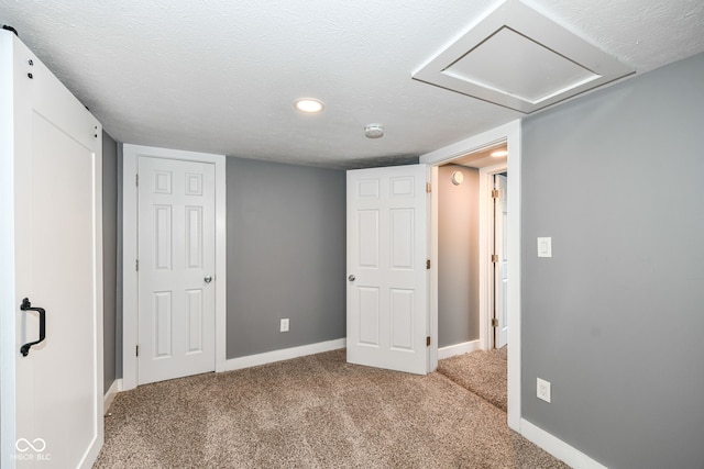 basement featuring baseboards, recessed lighting, and carpet floors