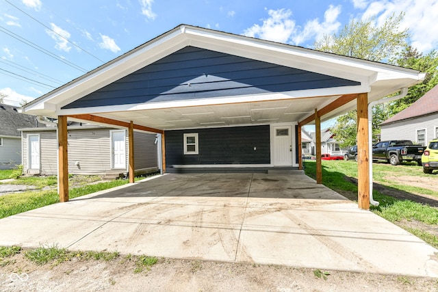 exterior space with a carport and concrete driveway